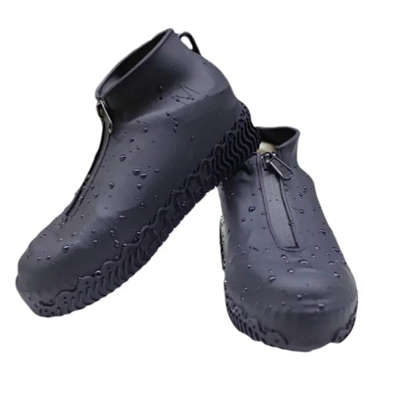 Waterproof silicone zippered shoe covers with droplets, designed for protection and non-slip grip in wet conditions.